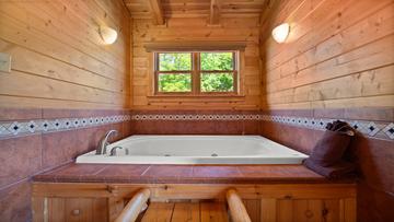 Cabin Jacuzzi Tub Jacuzzi tub in your Smoky Mountains cabin's fourth bedroom.